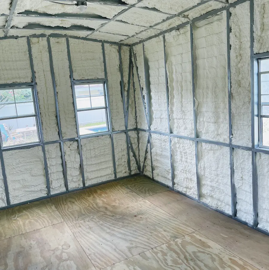 Closed-cell spray foam insulation applied to wall cavities in a residential project in Metairie